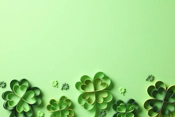 istock Flat lay composition with paper art four-leaf clover on green background. Happy St Patricks Day concept. 1959982859