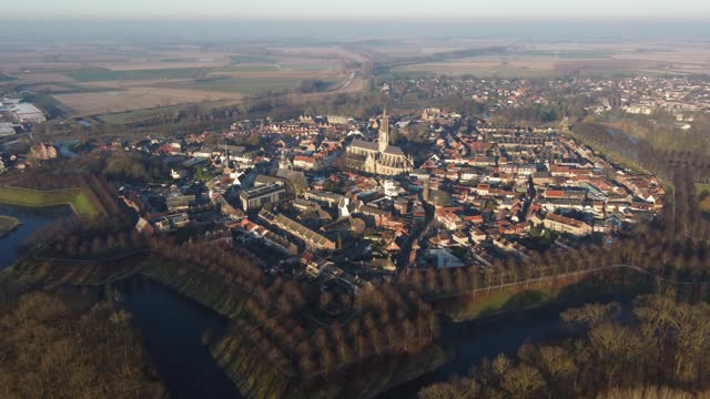 Aerial view of the historic city of Hulst surrounded by an eight-pointed star-shaped canal in the southern part of the Netherlands in the Zeeland region