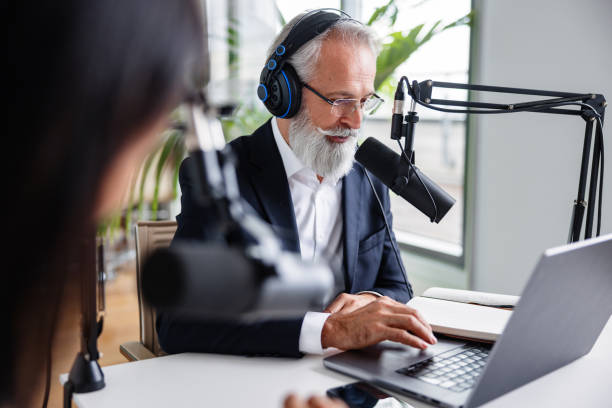 istock Thoughtful Podcast Host Discussing Business Topics 1959997385