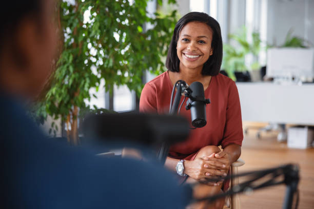 Confident Female Business Manager Recording a Podcast