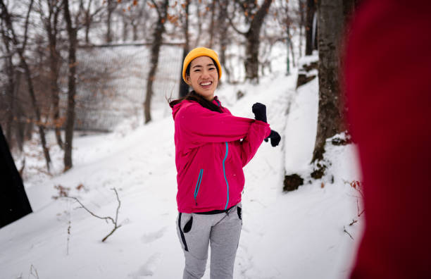 istock Snowy day and jogging in the park 1960006592