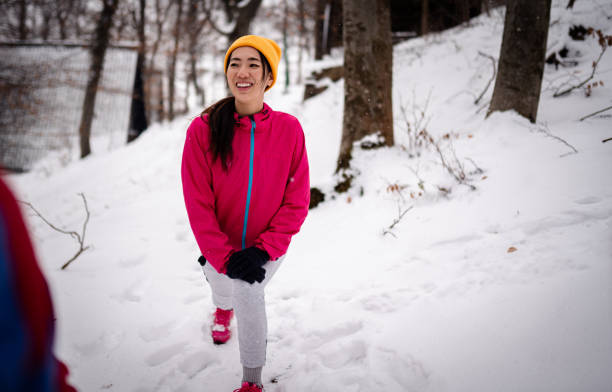 istock Snowy day and jogging in the park 1960009915