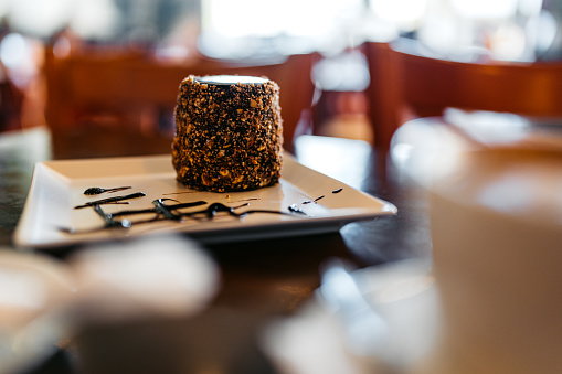 A chocolate dessert on the table in a pub.