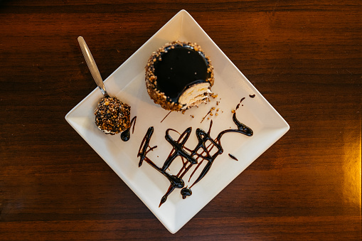 A chocolate dessert on the table in a pub.