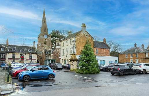 A busy summer day along the main shopping area, High Street at Bourton-on-the-Water, a village in the rural Cotswolds area of south central England.