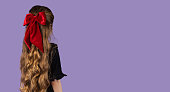 Back portrait photo of little blonde girl with long hair with space for text or copy for banners.