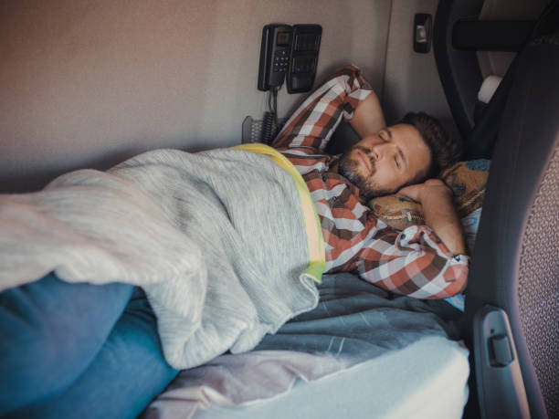 istock Exhausted Male truck Driver Sleeping 1960104989