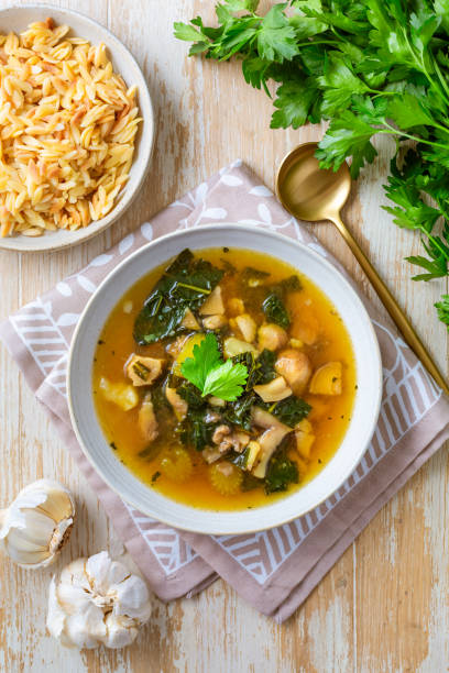 homemade miso mushroom soup with vegetable and kale - bamboo brown cooking gourmet fotografías e imágenes de stock