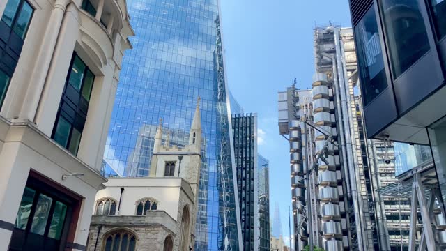 London pan through City Square Mile Financial District gleaming skyscrapers