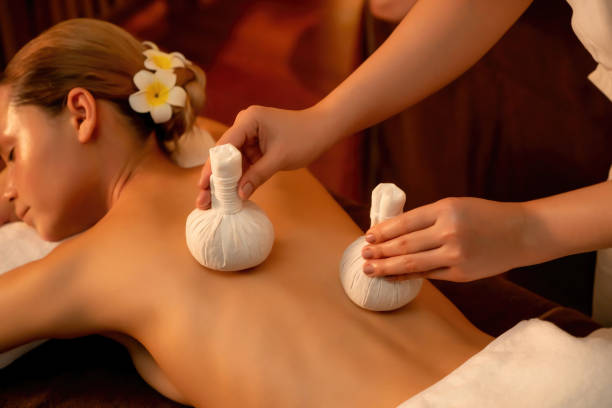 istock Hot herbal ball spa massage body treatment. Quiescent 1960112596