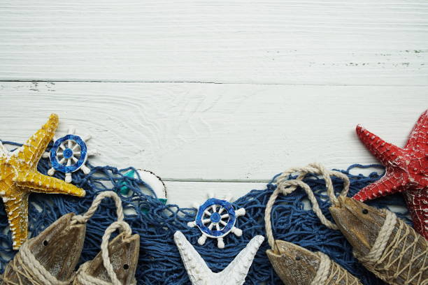 Nautical and summer background top view on wooden background