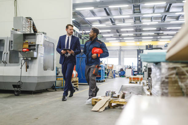 istock Sophisticated Caucasian Male Manager Giving Feedback To His Warehouse Worker While Strolling Around The Storage 1960125872