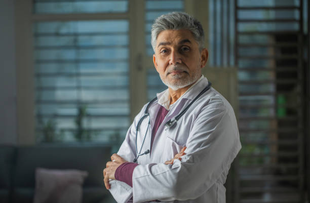 istock Old healthcare worker in clinic 1960149215