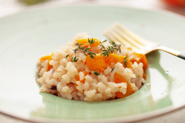 istock Pumpkin risotto with fresh thyme in plate. Italian Food 1960150936