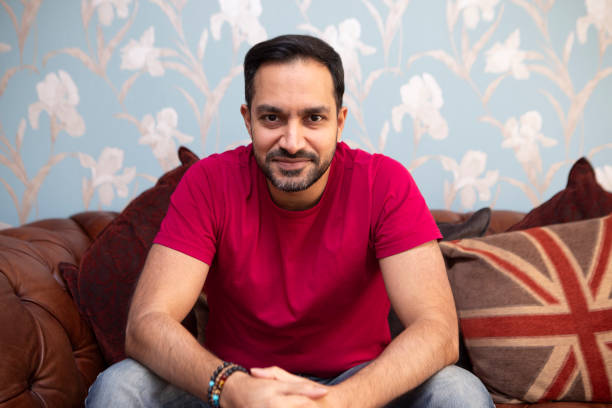istock Portrait of a relaxed and confident man on a sofa 1960159976