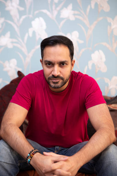 istock Portrait of a relaxed and confident man on a sofa 1960161566