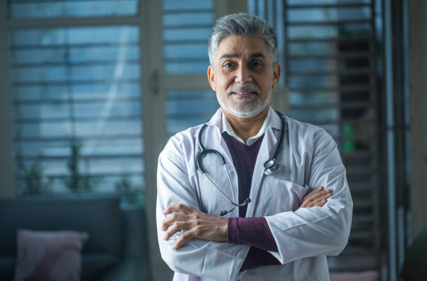 istock Old healthcare worker in clinic 1960162136