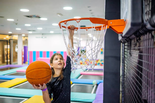 istock Kids having fun at indoor playground playing basketball 1960165421