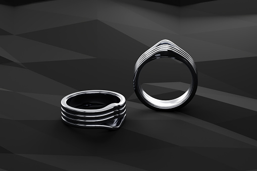 Two platinum rings on black background, Modern and retro style ring design ideas. 3D render.