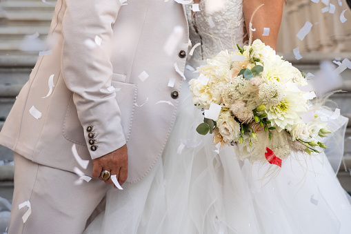 A close up on the hands on wedding day