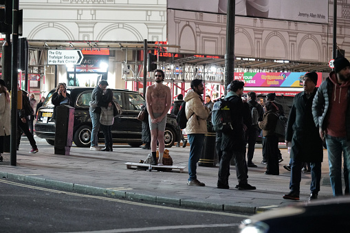 Central London, England, United Kingdom, Great Britain – January 2024: In this photograph, a group of people can be seen walking along a London street - located near Regent Street in london.