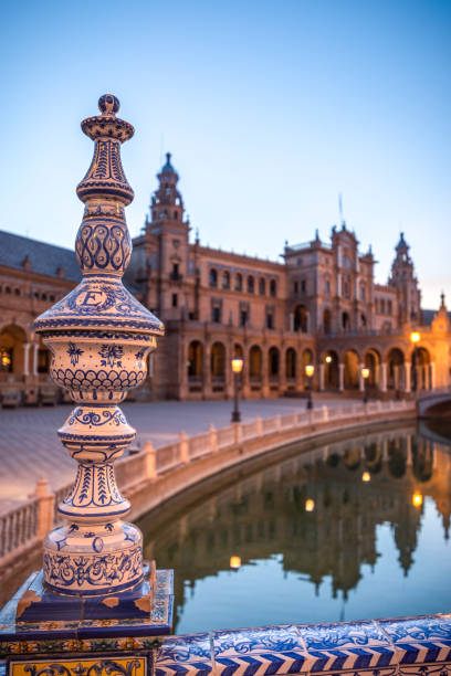 Detail in Plaza de Espana water canal reflections very early in the morning, Seville, Spain