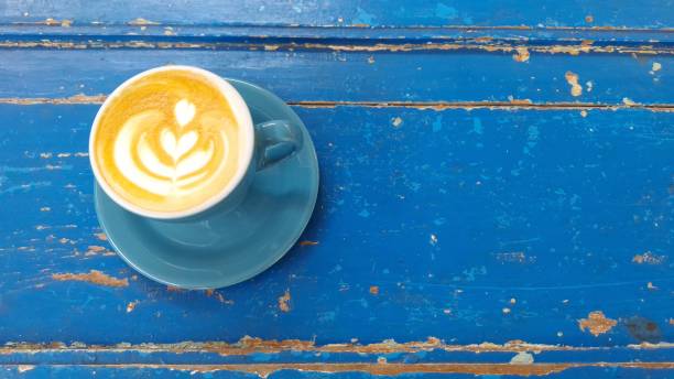 istock Top view of hot vanilla coffee latte and empty space for text on right side. 1960216911