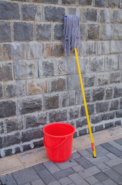 istock Mop and Red plastic bucket. Cleaning supplies. 1960217968