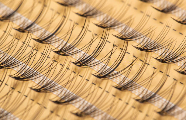 Modern set of false eyelashes for gluing. Women's cosmetics, close-up Modern set of false eyelashes for gluing. Women's cosmetics. clump eyelashes stock pictures, royalty-free photos & images