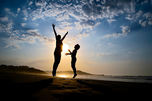 Mother and daughter, silhouette, figures, jump, laughter joy