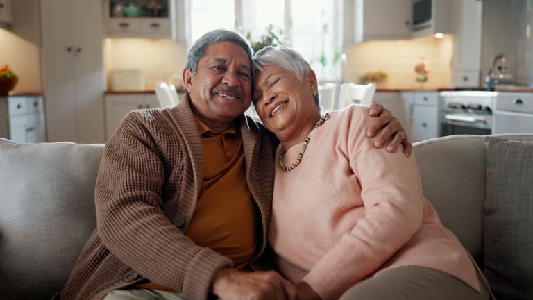 Home, hug and senior couple with a smile, funny and retirement with bonding, relationship and marriage. Romance, elderly man and old woman embrace, relax and humor with commitment, romantic and laugh