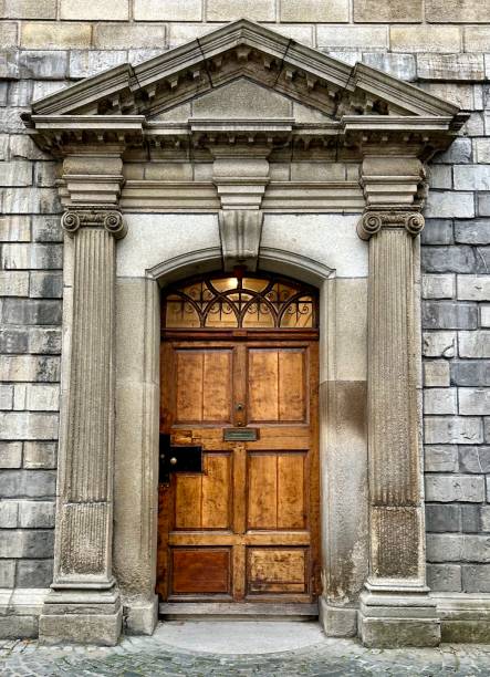 istock Classical Greek Ionic stone archway and wood door. 1960246095