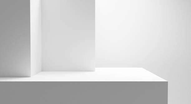 istock Blank white podium platform for product placement and design, empty space white table with bright light isolated on white wall, empty gray gradient room with blank podium, abstract forms background 1960248227