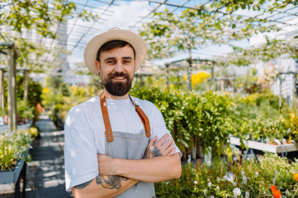 istock Male worker in garden centre looking at camera. 1960249785