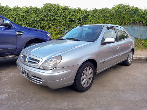 Avellaneda, Argentina - May 7, 2023: Modern silver gray 2000s Citroen Xsara five door hatchback at a classic car show in the street