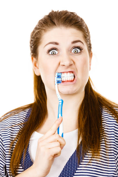 istock Woman brushing cleaning teeth. 1960278801