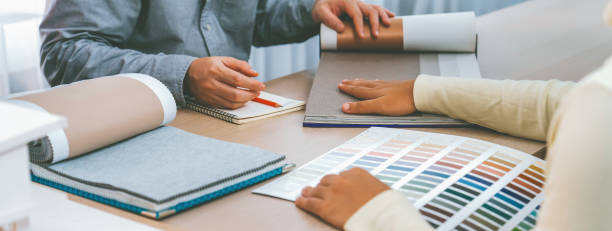 istock Architect and interior designer discussing about curtain material. Variegated. 1960284718