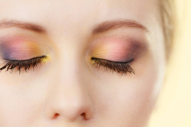 istock Woman having colorful makeup 1960309706