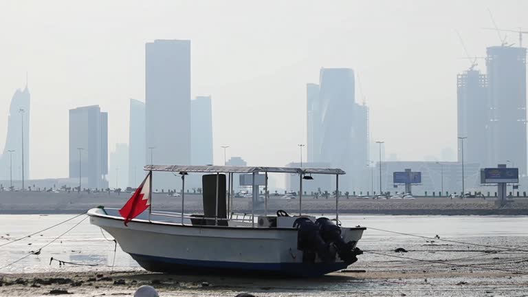 Boat with the flag of Bahrain in fisherman bay Manama Bahrain