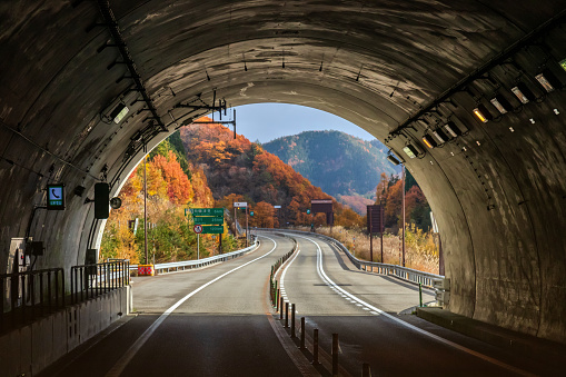 Takayama, Japan-November, 2019 The tunnel on a highway leads to Takayama from Shirakawa. Beautiful autumn view of the road through the tunnel in the mountains.