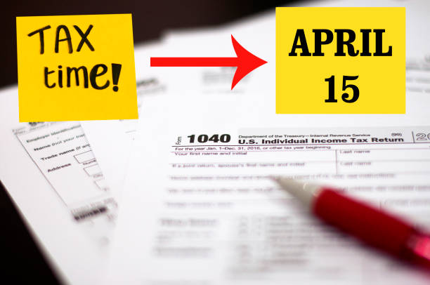 istock Tax Season: 1040 U.S. Individual Income Tax Return Form 1960320310