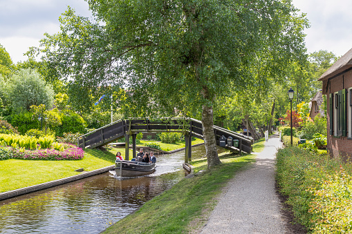 Giethoorn, Netherlands, May 23, 2023; Tourists sail through the picturesque village of Giethoorn in Overijssel.