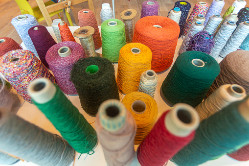 Making traditional scottish tartan textile yarn thread at dundee scotland england UK