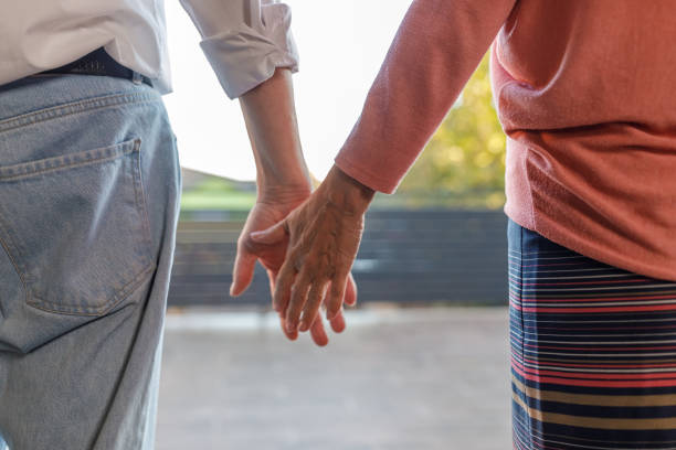 istock Mature couple about to hold hands together 1960342089