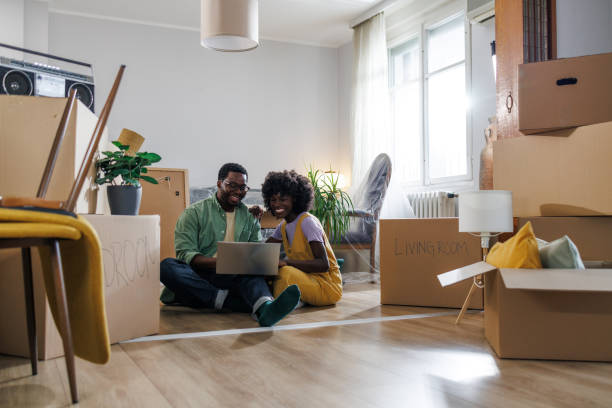 istock Young couple in their new home 1960344789