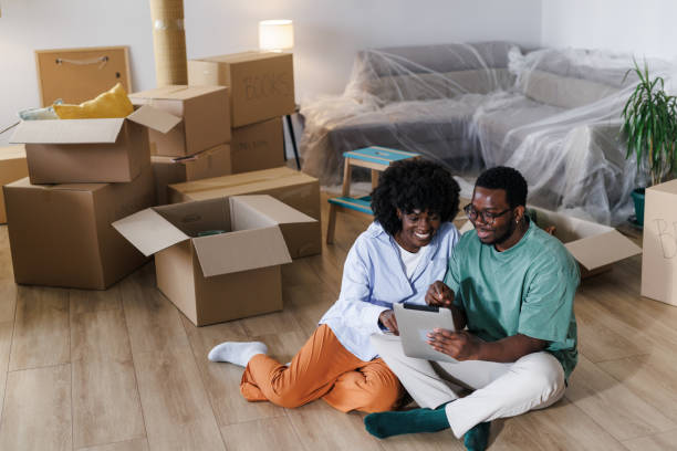 istock A man and a woman using a digital tablet after moving into a new home 1960345886
