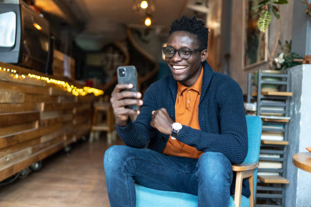 istock Happy young man reading good news using a smart phone 1960388022