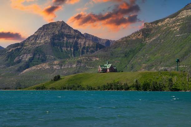 A colourful sunset sky over Waterton Lake mountains in the summertime.