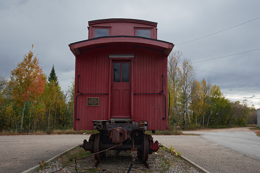 Barry's Bay, Ontario, Canada; 14th of October, 2023:  A front view photo of a wooden rail car in Water Tower Park