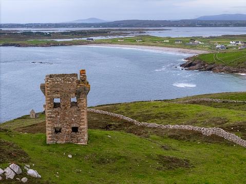 Aerial view of old ruined tower and Maghery beach